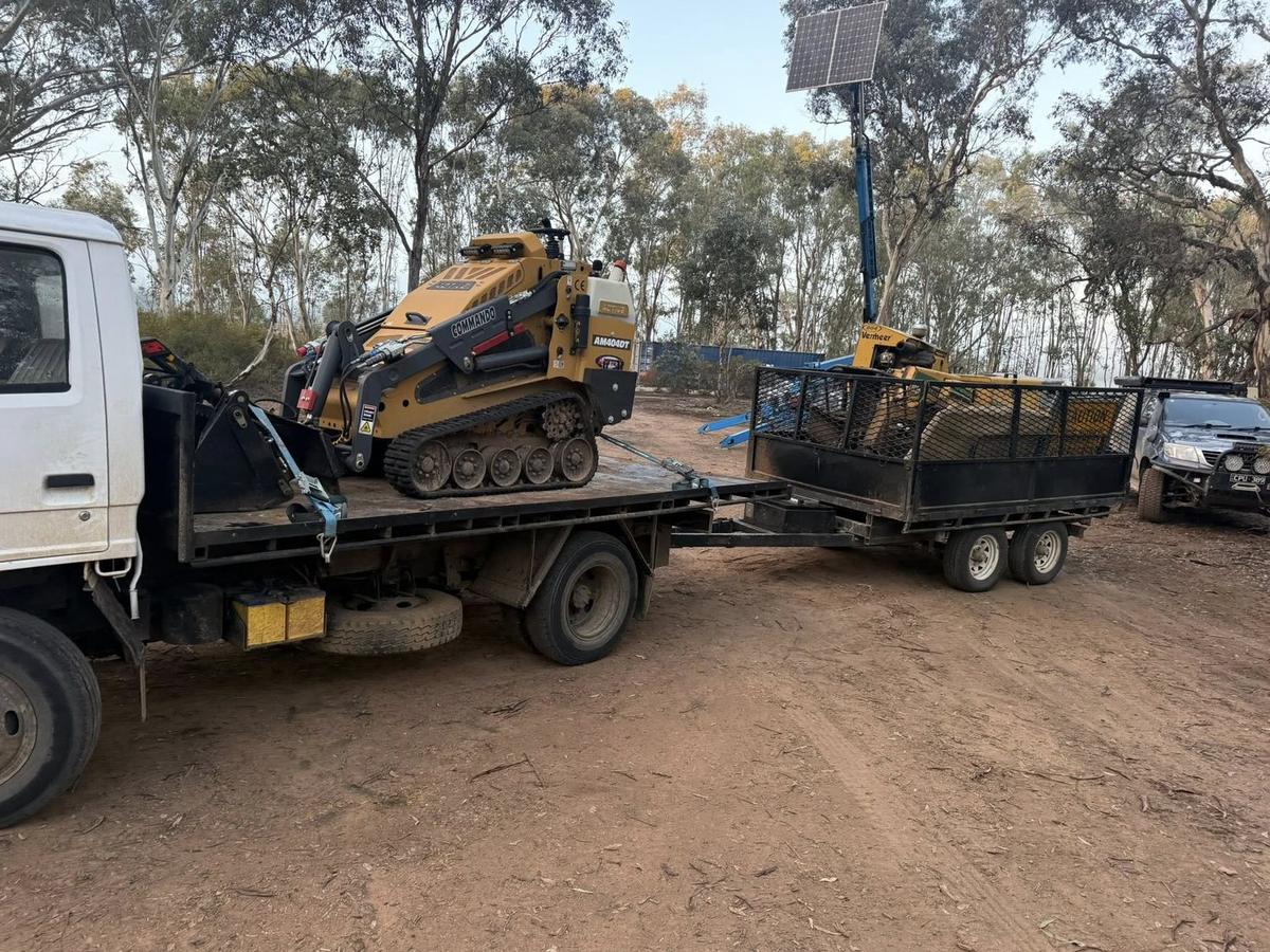 TB'S Trees truck and trailer loaded with logs after a tree removal